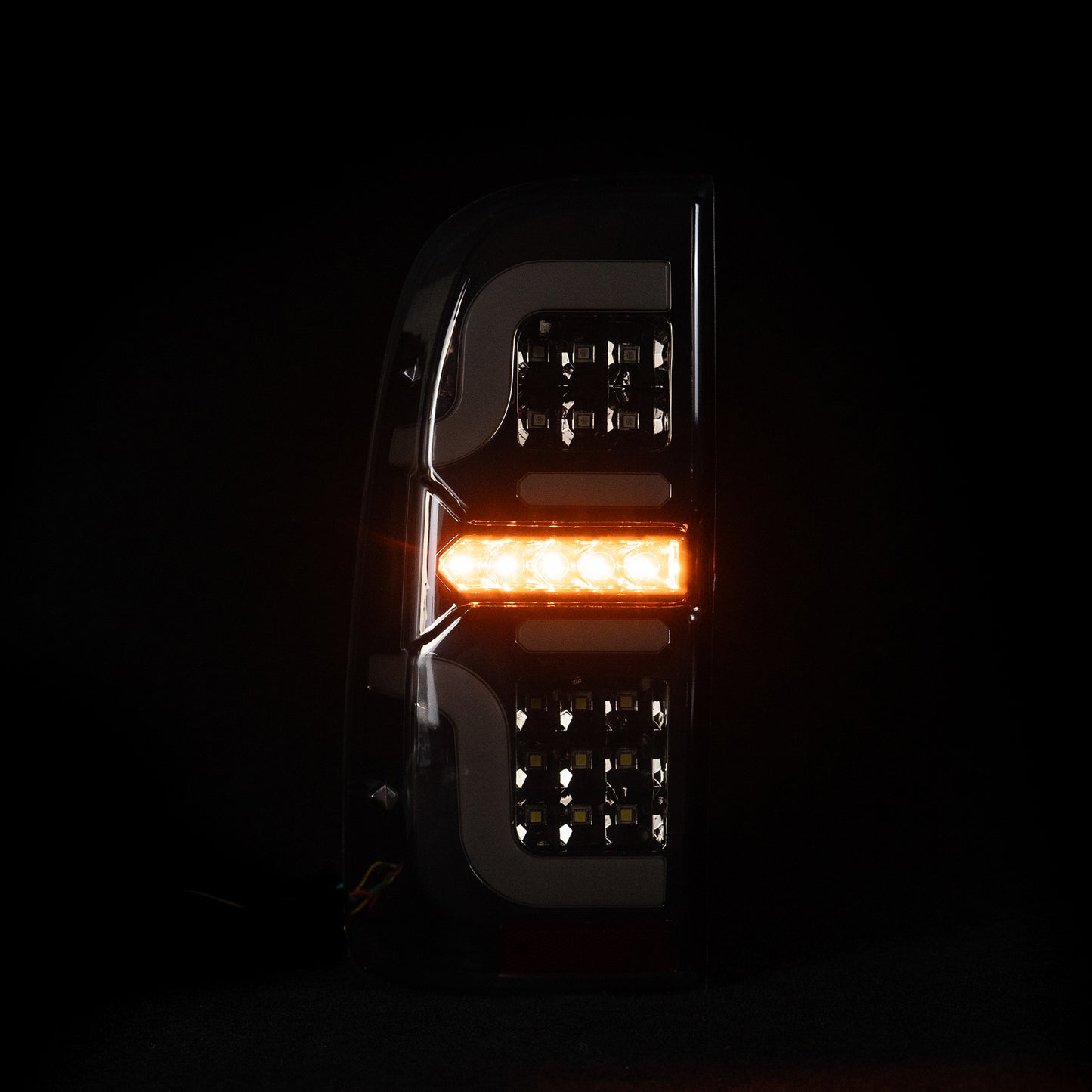 Blacked Out 'Swirl' LED Tail Lights for N70 Hilux