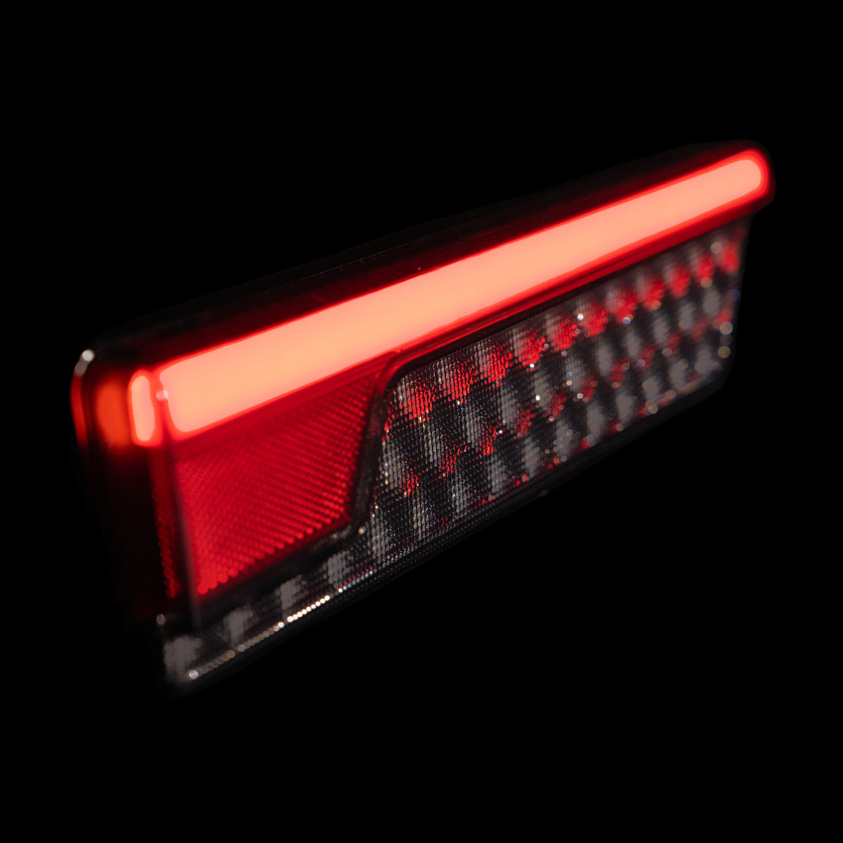 Close up of Universal LED Tray Tail Light clear lens and red reflector - Bushdoof Lighting