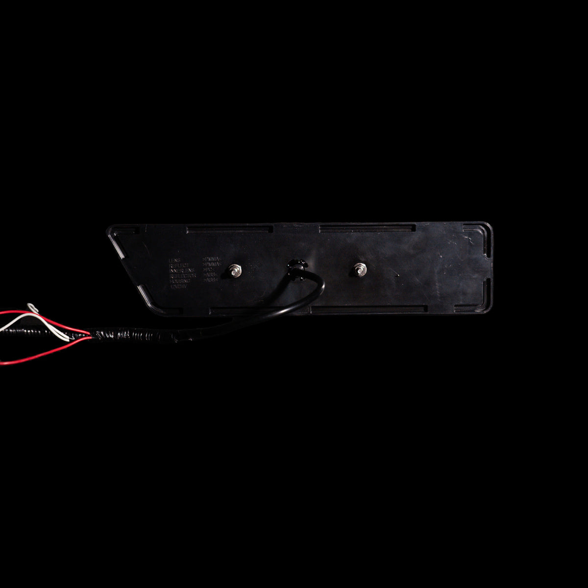 Back of Universal LED Tray Tail Light showing flat flange, two mounting studs and wiring lead - Bushdoof Lighting