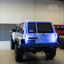 images of 4ft LED Whip Lights from Bushdoof Lighting mounted on the back of a white vehicle
